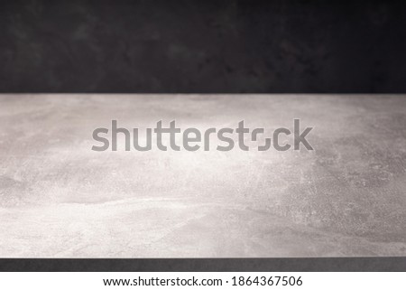 wooden table or tabletop near wall background, front low angle view
