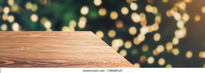 Wooden Table Top With Abstract Blur Christmas Tree With String Light Background With Bokeh Light,winter Holiday Backdrop,Mock Up Banner For Display Of Product