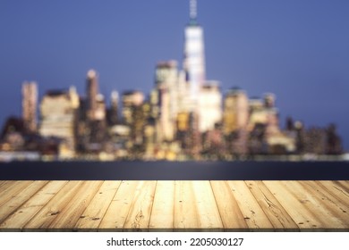 Wooden Table Top With Beautiful Blurry Skyline At Night On Background, Mockup