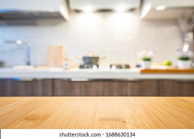 Wooden Table Top On Blur Kitchen Room Background.
For Displaying The Assembly Product Or Visual Arrangement Of The Configuration Keys