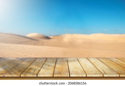 Wooden Table Top On Blur Desert Background.Hot Weather And Drink Somethings For Fresh.Juice And Cold Water.For Montage Product Display Or Design Key Visual Layout.View Of Copy Space.