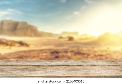 Wooden Table Top On Blur Desert Background.Hot Weather And Drink Somethings For Fresh.Juice And Cold Water.For Montage Product Display Or Design Key Visual Layout.View Of Copy Space.