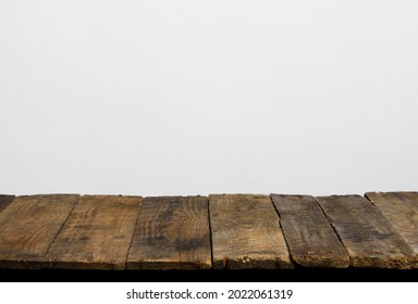 Wooden Table Top From Rustic Old Wood Planks With Neutral Gray Wall Background.