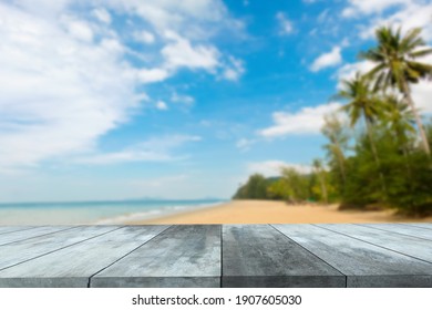 Wooden Table Top Stands For Display Product With The Blurred Beach And Sea Background.