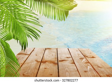 Wooden Table With Tropical Paradise Background