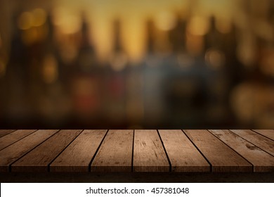 Wooden Table With A View Of Blurred Beverages Bar Backdrop