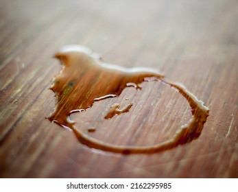 Wooden table with water stains spilled from glass