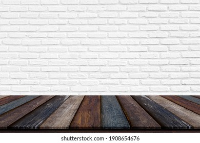 Wooden table with white brick wall. Use as montage for product display