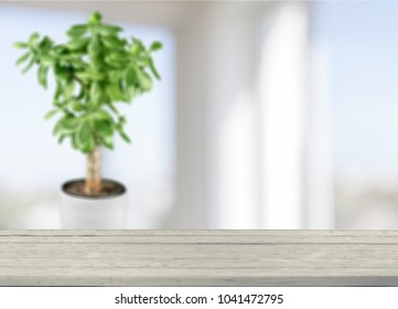 Wooden table with window background