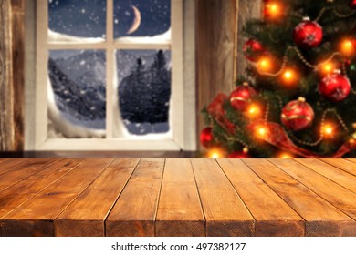 Wooden Table And Xmas Tree In Interior With Xmas Window 