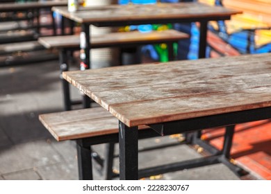 Wooden tables of street terrace . Empty tables of outdoor beer restaurant - Shutterstock ID 2228230767