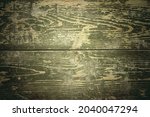 Wooden texture of camouflage green color from a military box. Vintage style.Space for the text.