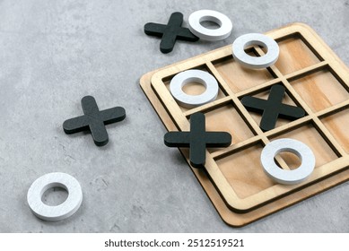 Wooden Tic Tac Toe Game on a Table: Classic Strategy and Fun for All Ages - Powered by Shutterstock