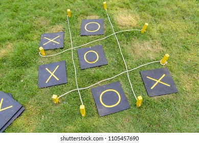 Wooden Tic Tac Toe Or OX Game On Grass - Outdoor Game