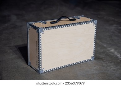 Wooden tool box with blank space for your logo and company product placement. Product in warehouse on cement floor - Shutterstock ID 2356379079
