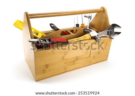 Wooden toolbox with tools isolated on white
