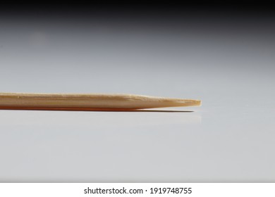 wooden toothpick stick lying on the table macro photo blurred background