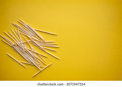 Wooden toothpicks on light background. place for text