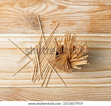 Wooden Toothpicks on Wood Background with Copy Space, Flat Lay Tooth Picks, Toothpicks Top View Mockup with Space for Text, Daily Dental Care Concept Banner
