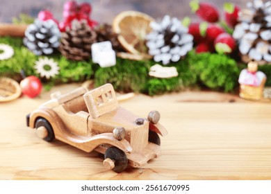 Wooden toy car among classic Christmas decorations. - Powered by Shutterstock