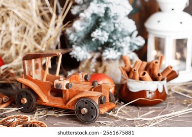 Wooden toy car among classic Christmas decorations. - Powered by Shutterstock