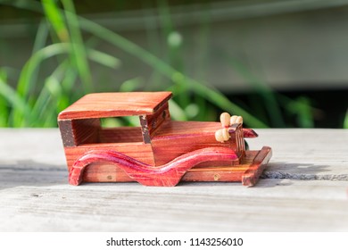 Wooden Toy Car Without Wheels On Wooden Desk Outdoors