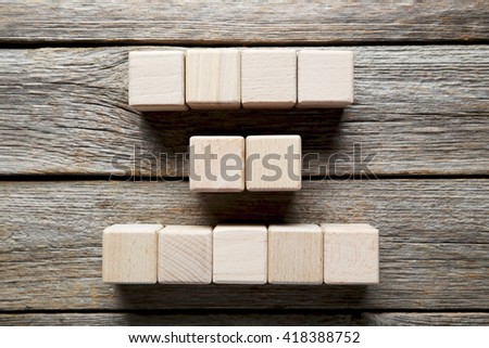 Wooden toy cubes on a grey wooden table