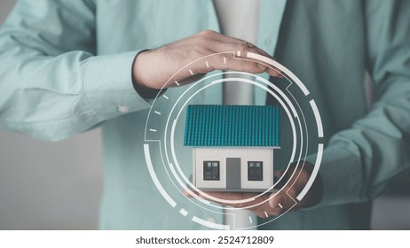 Wooden toy house protected by hand, home insurance concept, house model with real estate agent and client discussing home purchase contract, insurance or real estate loan. - Powered by Shutterstock