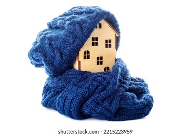 Wooden Toy House With Warm Hat And Scarf Isolated On White Background