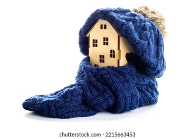 Wooden Toy House With Warm Hat And Scarf Isolated On White Background