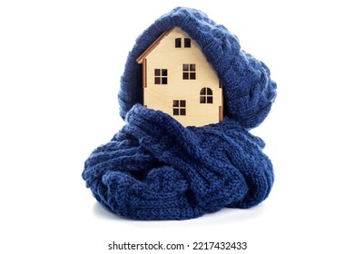 Wooden Toy House With Warm Hat And Scarf Isolated On White Background