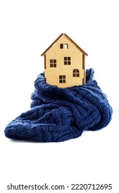 Wooden Toy House Is Wrapped In A Warm Scarf Isolated On White Background