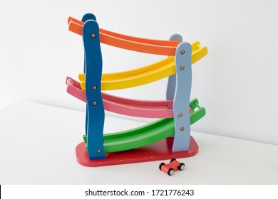 
Wooden Toy With Red Car Ramps With White Background