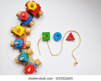 Wooden Toy Train With Colorful Blocks Isolated White Background. Early Childhood Education, Learning To Count, Preschool And Kids Game Concept.