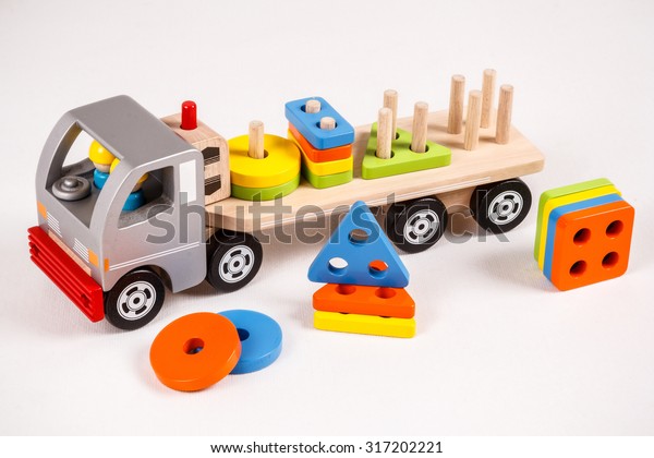 Wooden toy truck on the\
white background
