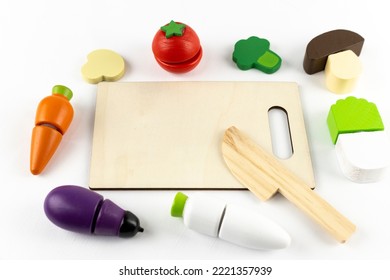 Wooden Toy Vegetables, Kitchen Knife And Cutting Board. Image Of Cooking