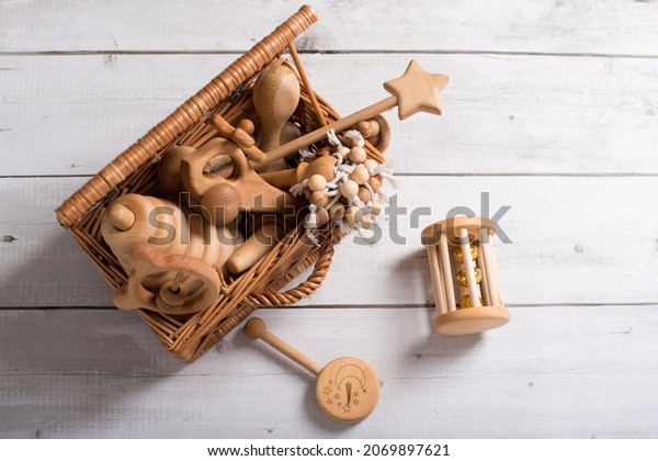 wooden toys, eco-friendly toys, toys\
for children made of wood, a set of toys made of wood on a light\
background. Wooden toy airplane isolated on\
white