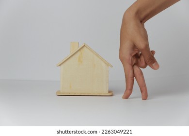 wooden toys house with hand.  - Shutterstock ID 2263049221