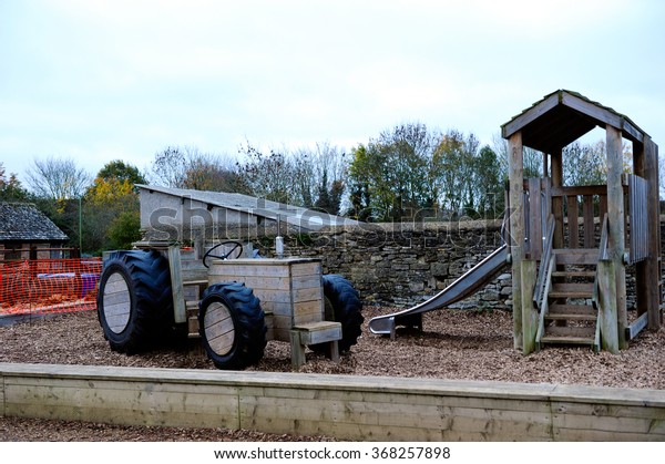 Wooden tractor model in a\
farm