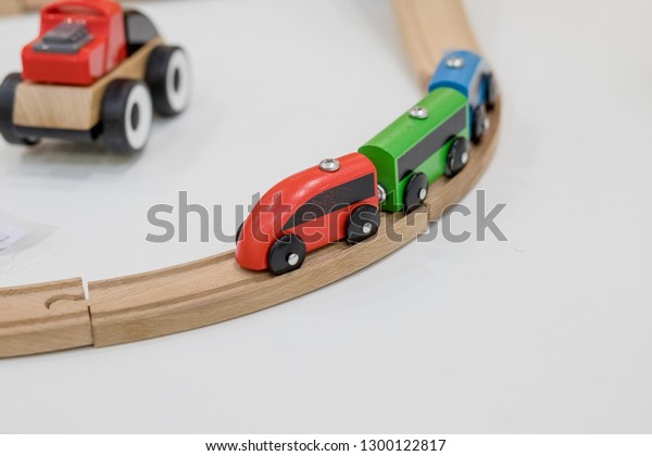 wooden train, build toy railroad at home\
or daycare. Wooden toy train with colorful blocs isolated on white\
background. Educational toys for preschool and kindergarten child.\
indoor playground.Copy