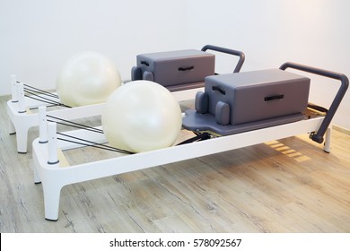 Wooden trainers with fitballs for pilates - gym equipment in fitness center - Powered by Shutterstock