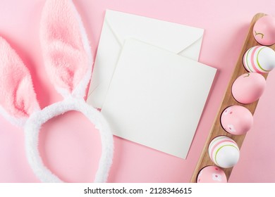 Wooden Tray With Easter Eggs, Fluffy Bunny Ears And White Empty Card For Congratulations. Mockup. Easter Holiday Concept. Top View, Copy Space. Flat Lay