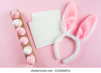 Wooden Tray With Easter Eggs, Fluffy Bunny Ears And White Empty Card For Congratulations. Mockup. Easter Holiday Concept. Top View, Copy Space. Flat Lay