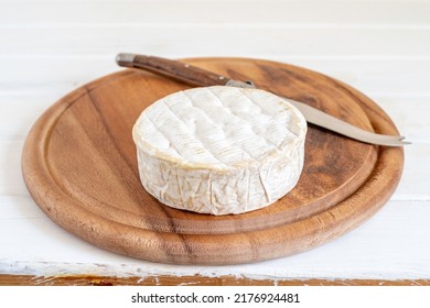 Wooden Tray With Traditional French Brie Cheese.