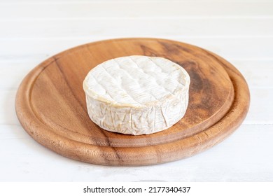 Wooden Tray With Traditional French Brie Cheese.