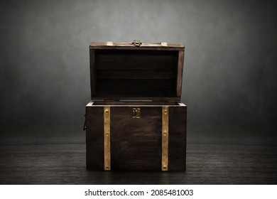 Wooden treasure chest on dark background - Shutterstock ID 2085481003