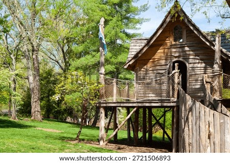 Wooden treehouse rustic structure elevated playhouse tree house architecture childhood play outdoor playhouse forest treehouse backyard structure May 15, 2015 Nashville, Tennessee