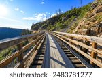 Wooden trestle bridge along the Myra Canyon Trestles trail, a section of the Kettle Valley Rail Trail located south of Kelowna on Okanagan Mountain, British Columbia, Canada
