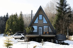 Wooden Triangle Country Tiny Cabin House With Hot Tub Spa And Suv Car With Roof Rack In Mountains. Soul Weekends.