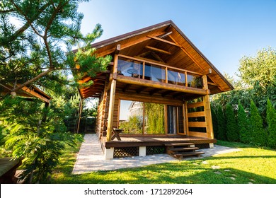 Wooden two-story house in spring nature